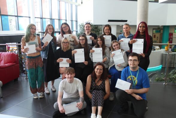 Group photo of all the Health T Level students with their teacher Wendy Gibbs in the centre
